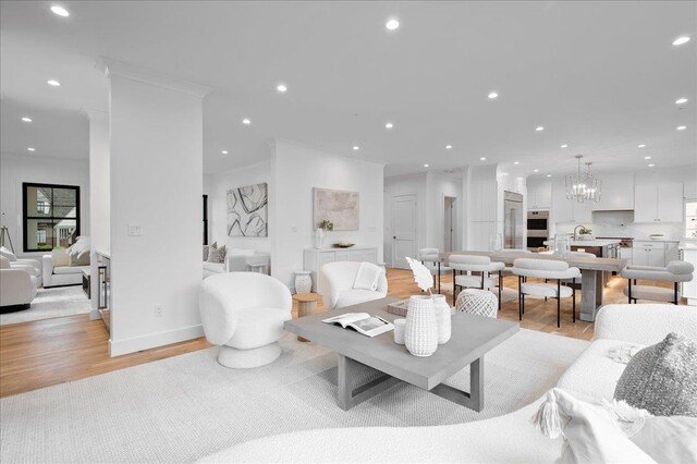12 Fairway Ave, Rye, NY 10580 - living room with light wood-type flooring, a chandelier, recessed lighting, and crown molding