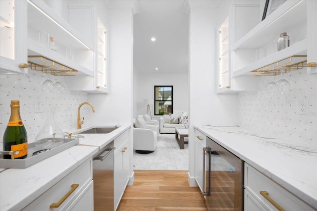 12 Fairway Ave, Rye, NY 10580 - kitchen featuring a sink, wine cooler, open shelves, light wood finished floors, and white cabinets