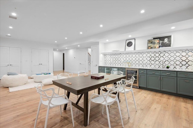 12 Fairway Ave, Rye, NY 10580 - dining room featuring beverage cooler, bar, recessed lighting, and light wood-type flooring