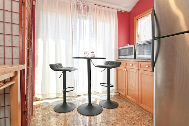 kitchen featuring stainless steel appliances and tile counters