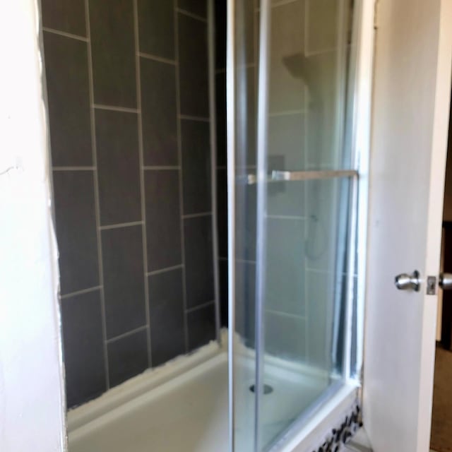 full bathroom with a shower with shower door