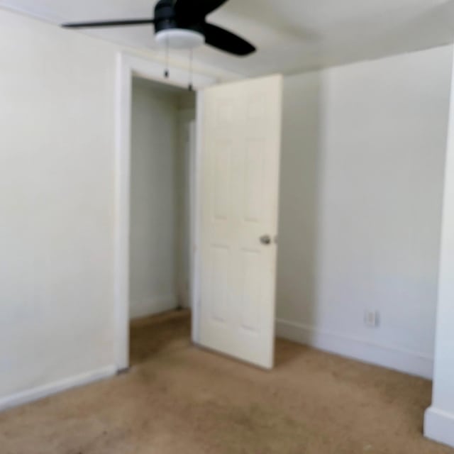 unfurnished bedroom with carpet and baseboards