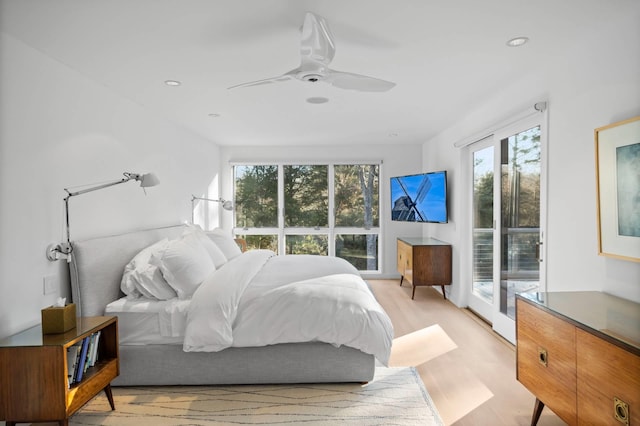 bedroom featuring light wood-type flooring and ceiling fan