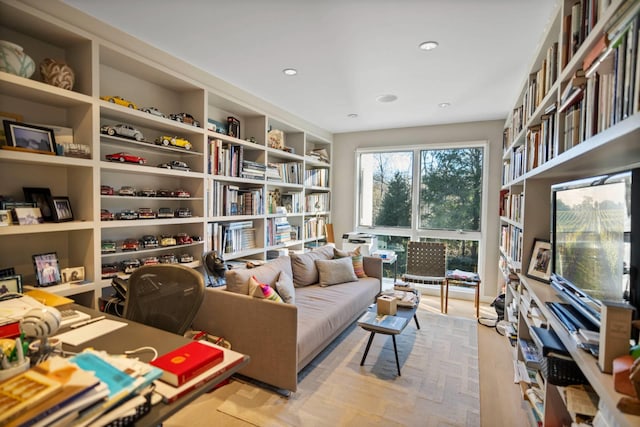 sitting room with wall of books