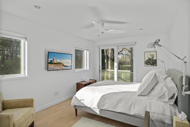 bedroom featuring baseboards, access to outside, ceiling fan, and light wood-style floors