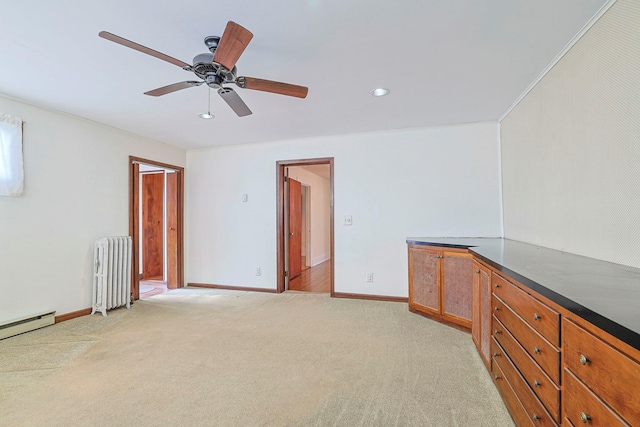 interior space featuring recessed lighting, radiator, light colored carpet, and baseboards