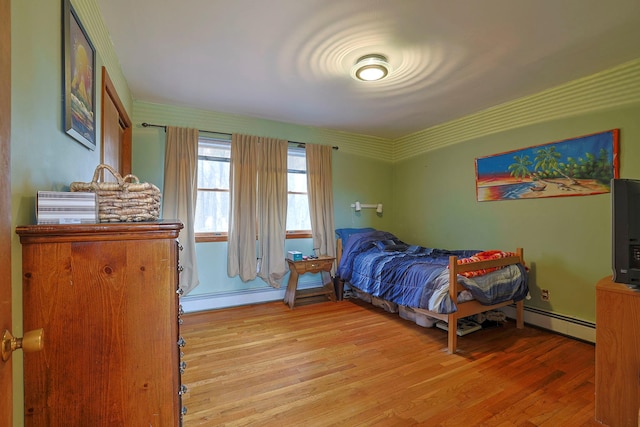 44 Karen Joy Dr, Middletown, NY 10940 - bedroom featuring a baseboard radiator, light wood-style flooring, and a baseboard heating unit