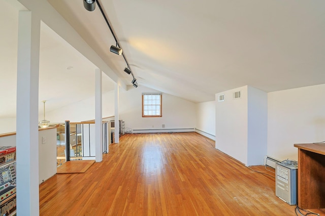 44 Karen Joy Dr, Middletown, NY 10940 - additional living space with light wood-type flooring, lofted ceiling, baseboard heating, ceiling fan, and a baseboard heating unit