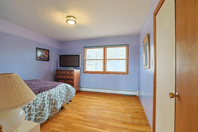 44 Karen Joy Dr, Middletown, NY 10940 - bedroom featuring a baseboard radiator and light wood-style floors