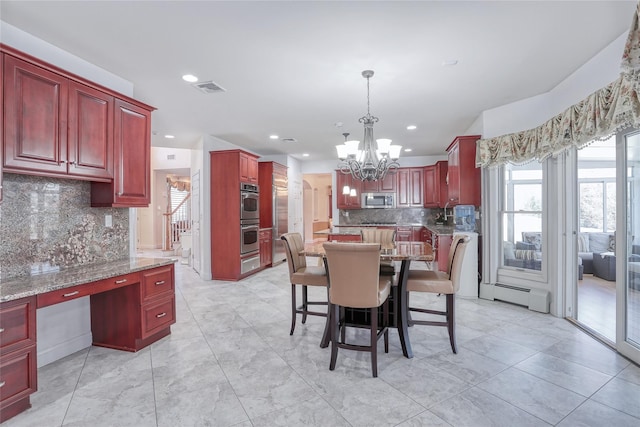 dining space featuring a baseboard radiator, recessed lighting, visible vents, stairs, and an inviting chandelier