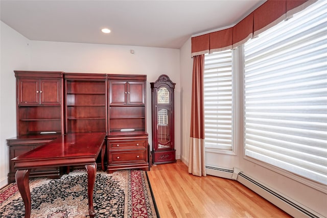 office with a baseboard heating unit, light wood finished floors, recessed lighting, and baseboards