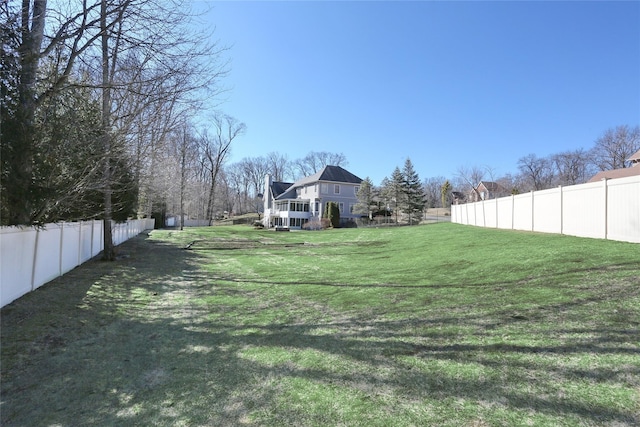 view of yard featuring a fenced backyard