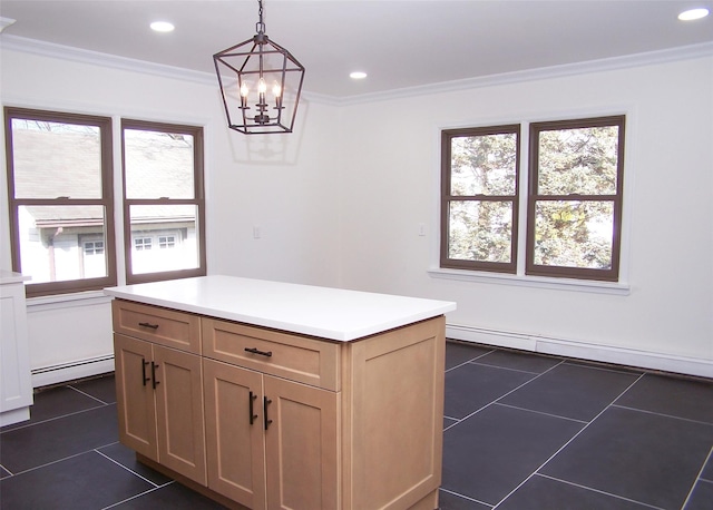 kitchen featuring light countertops, dark tile patterned flooring, baseboard heating, and pendant lighting