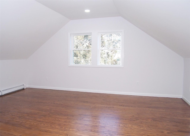 additional living space featuring lofted ceiling, recessed lighting, dark wood-style flooring, baseboards, and baseboard heating