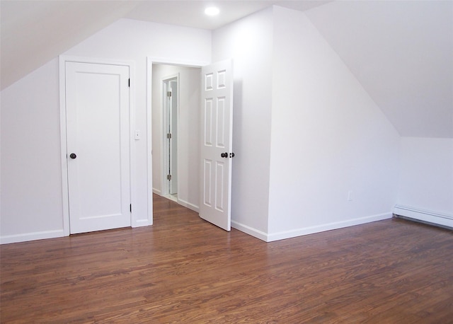 bonus room with lofted ceiling, dark wood finished floors, and baseboards