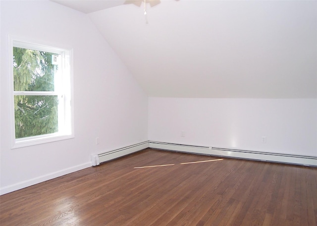 bonus room with lofted ceiling, dark wood-style flooring, and baseboards