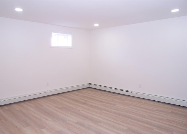 empty room with light wood-type flooring and recessed lighting