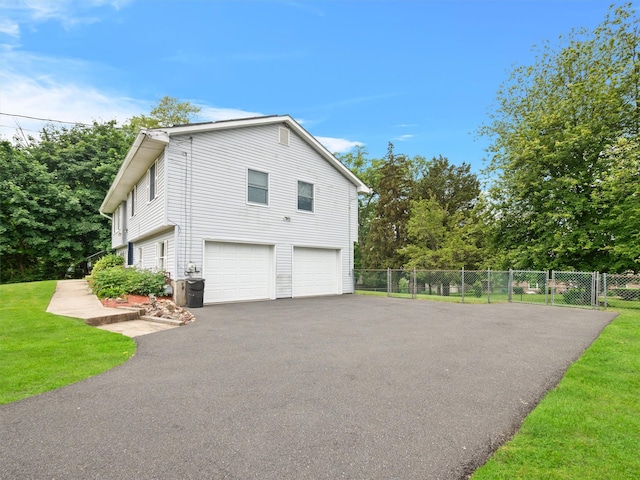 215 Old Haverstraw Rd, Congers, NY 10920 - view of home's exterior featuring asphalt driveway and an attached garage