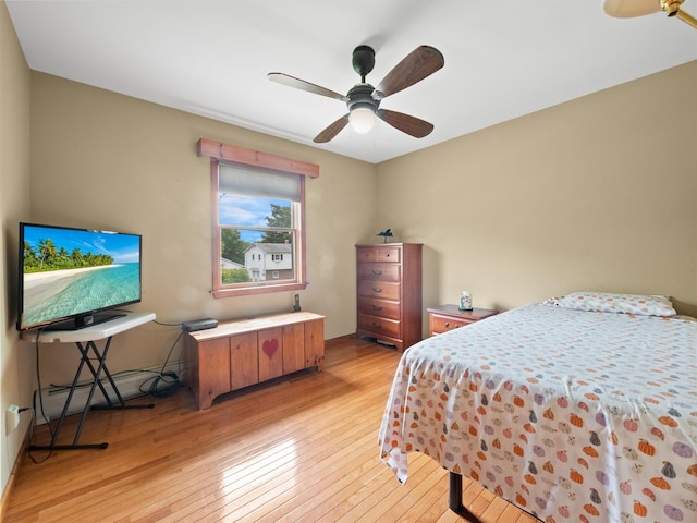 215 Old Haverstraw Rd, Congers, NY 10920 - bedroom featuring light wood-style floors, baseboard heating, and a ceiling fan