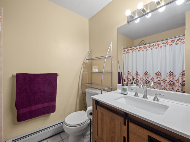 215 Old Haverstraw Rd, Congers, NY 10920 - full bath with a baseboard radiator, toilet, vanity, and tile patterned flooring