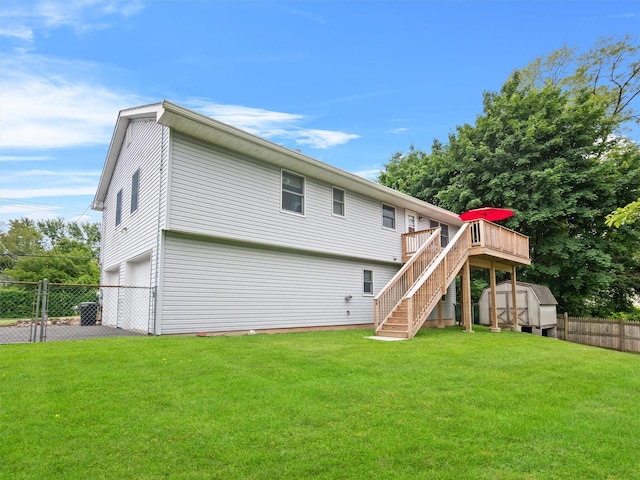 215 Old Haverstraw Rd, Congers, NY 10920 - back of property with stairs, an attached garage, a wooden deck, and asphalt driveway