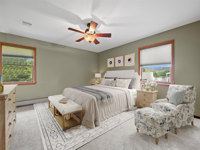 215 Old Haverstraw Rd, Congers, NY 10920 - bedroom with a baseboard heating unit, carpet floors, and a ceiling fan