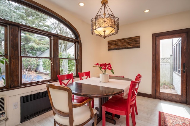 dining room with recessed lighting, radiator, and baseboards