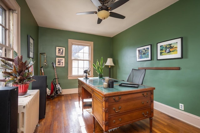 home office with ceiling fan, baseboards, and wood finished floors