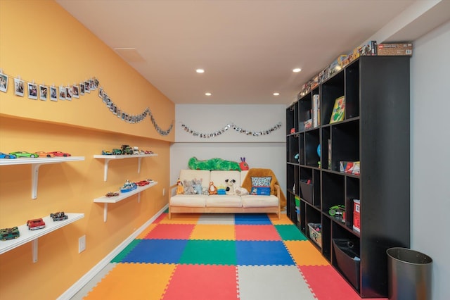 game room with baseboards and recessed lighting