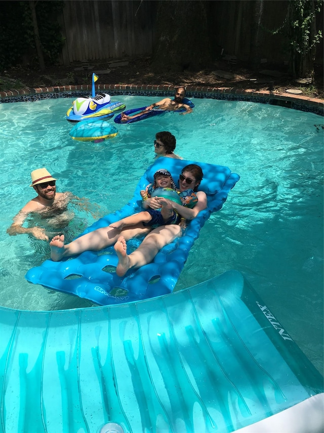 view of pool with a fenced in pool