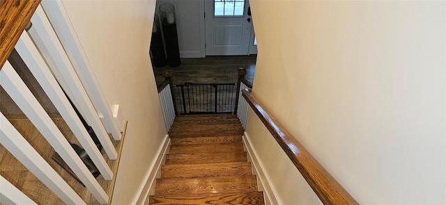 stairs with wood finished floors