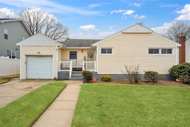 ranch-style home featuring an attached garage, driveway, a front yard, and fence