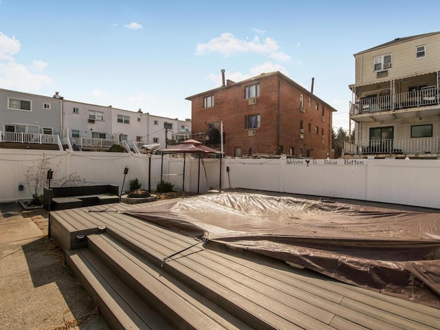 exterior space with an outdoor fire pit and fence