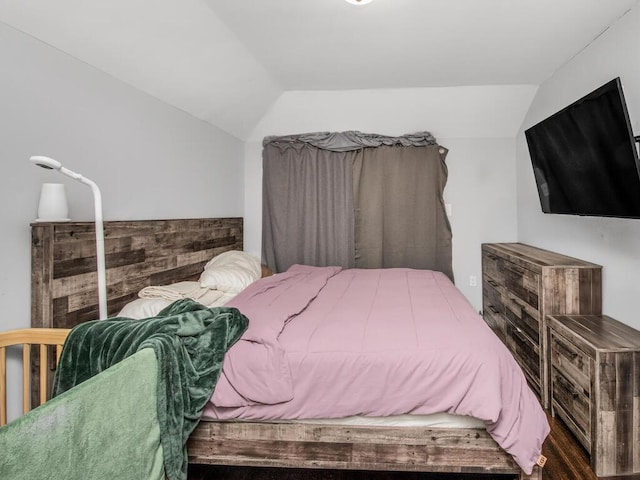 bedroom featuring lofted ceiling