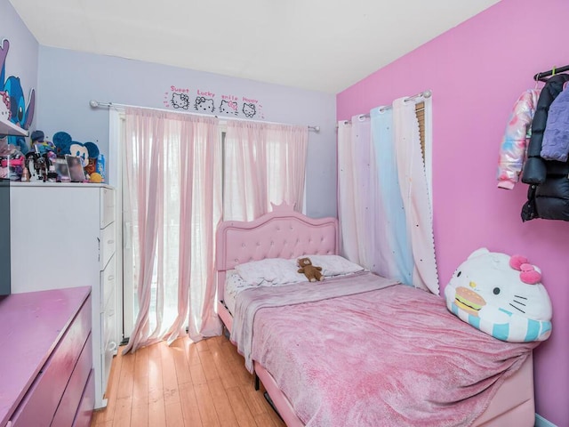 bedroom with light wood-style flooring