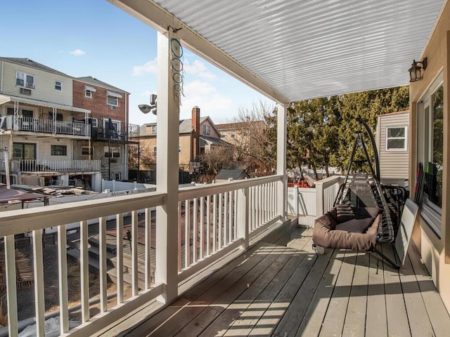 wooden terrace with a residential view