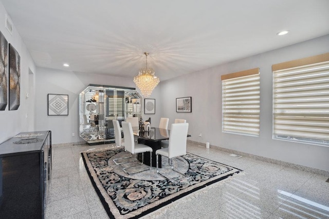 dining space with baseboards, a wealth of natural light, and recessed lighting