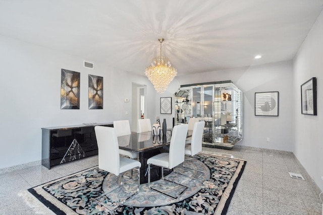 dining room with recessed lighting, granite finish floor, visible vents, and an inviting chandelier