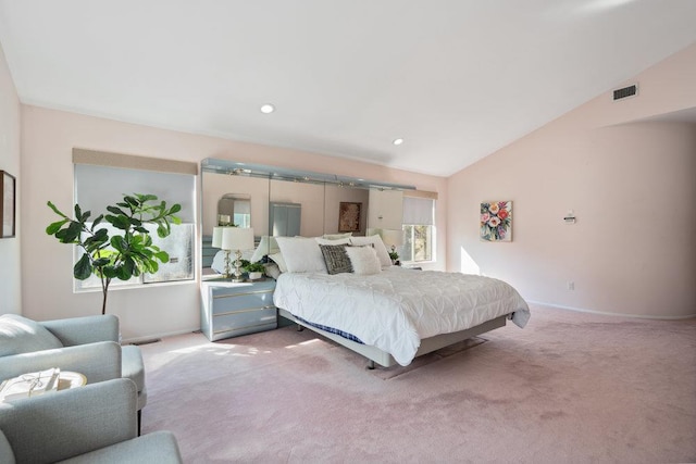 bedroom featuring carpet floors, baseboards, visible vents, and lofted ceiling