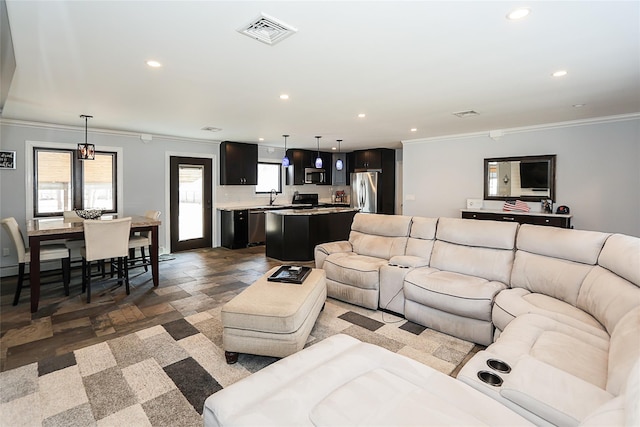 living room featuring recessed lighting, visible vents, and ornamental molding