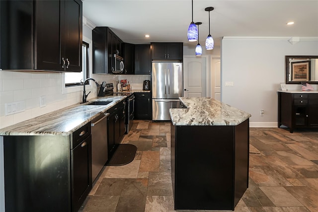 kitchen featuring a kitchen island, light stone counters, stainless steel appliances, pendant lighting, and a sink