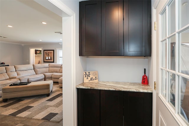 bar with ornamental molding, visible vents, and recessed lighting