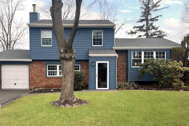 tri-level home featuring a garage, a front yard, driveway, and a chimney