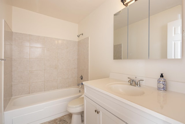 bathroom featuring tile patterned flooring, tub / shower combination, vanity, and toilet