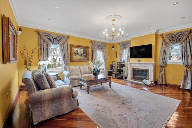 living area featuring baseboards, a premium fireplace, ornamental molding, dark wood-style flooring, and a notable chandelier