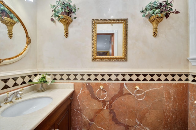 bathroom with wainscoting and vanity