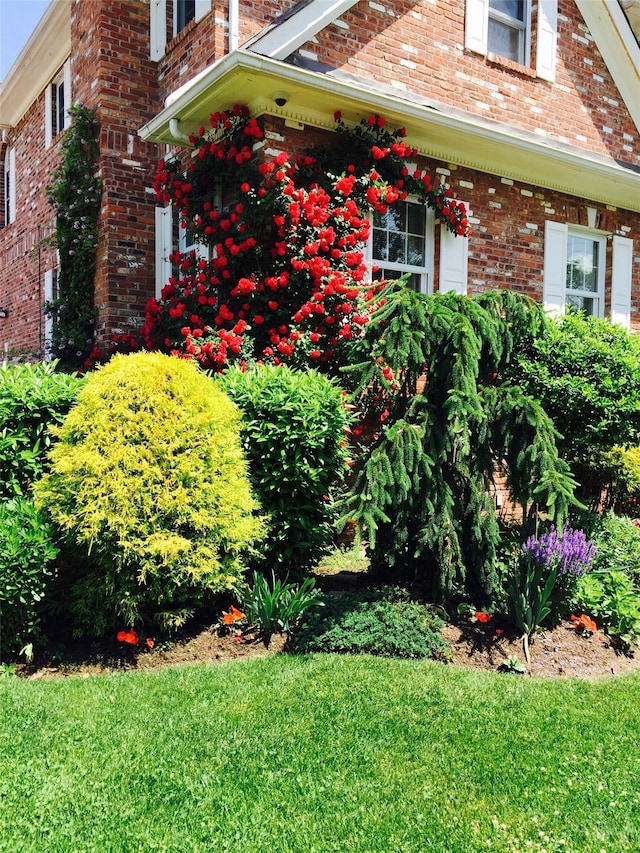 view of side of home featuring brick siding