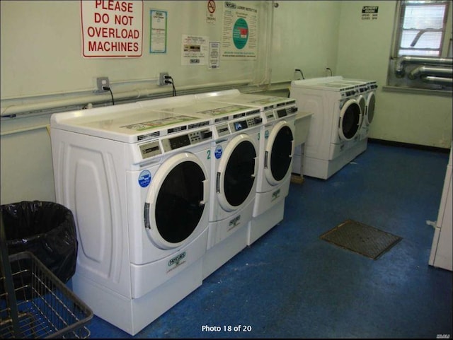 community laundry room featuring separate washer and dryer