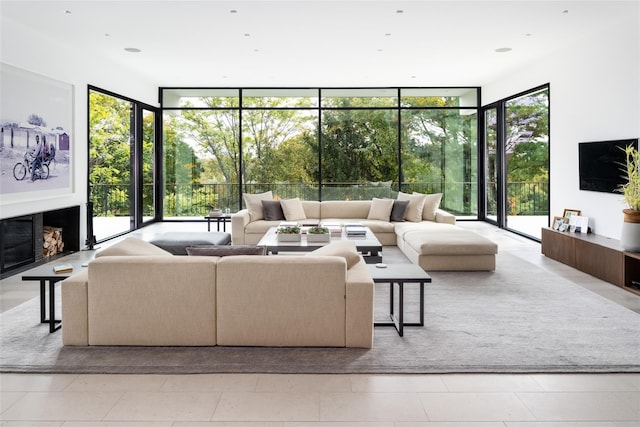 living area with expansive windows and a fireplace