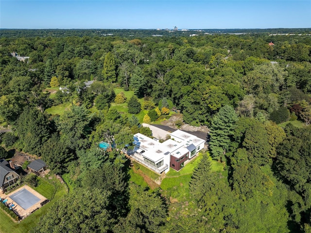 birds eye view of property with a forest view